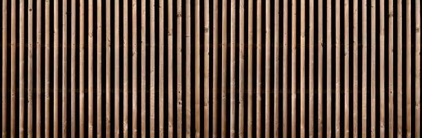 istock Panorama of a brown slatted partition wall 1311627330
