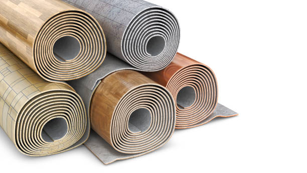 istock Rolled up linoleum stacked in different variations on white background, 3d illustration 1311627514