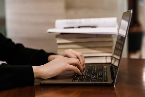 istock The young woman works at the laptop. Work process 1311627575