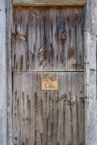 istock Do not enter sign on a rustic farm barn door 1311631288