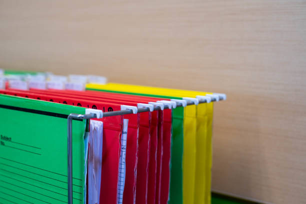 Financial document files arranged in filing cabinets.