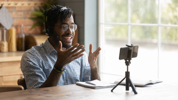 istock Active millennial black male teacher shoot video lesson for pupils 1311634184