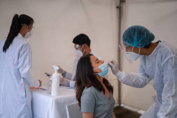 istock Woman getting a PCR COVID-19 test 1311635520