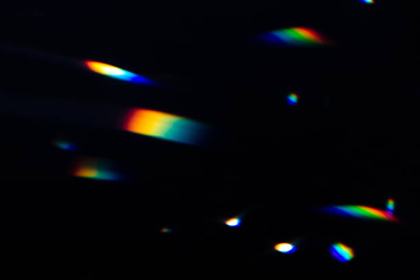 istock colorful warm rainbow crystal light leaks on black background 1311636562