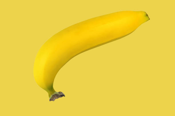 istock 1 banana isolated on orange background 1311636750