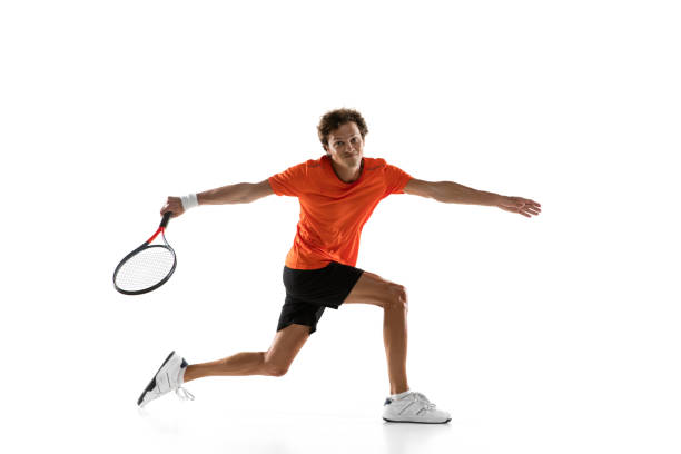 istock Young Caucasian man, tennis player training isolated on white background. 1311637092