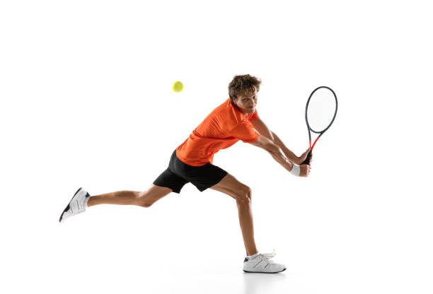 istock Young Caucasian man, tennis player training isolated on white background. 1311637100
