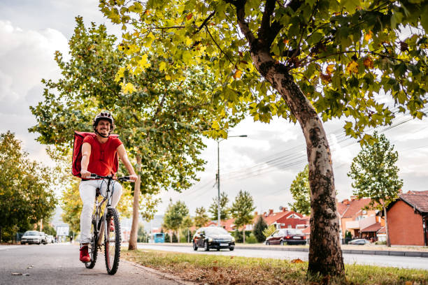 istock Delivery man riding a bike 1311637289
