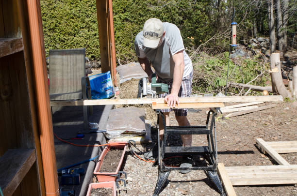 istock Man building sawing wood plank 1311638156