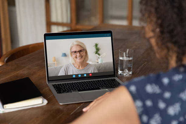 istock African female student having virtual meeting with old lady tutor 1311638370