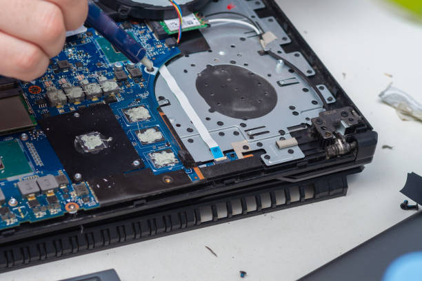 istock Applying a new thermal paste to the laptop cooling system from a tube 1311639761