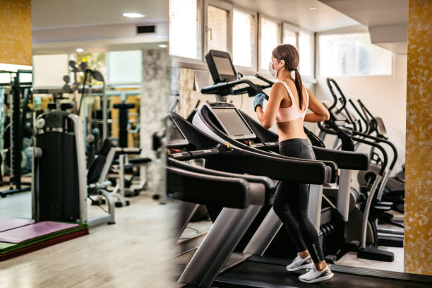 istock Woman running on treadmill in gym 1311639867
