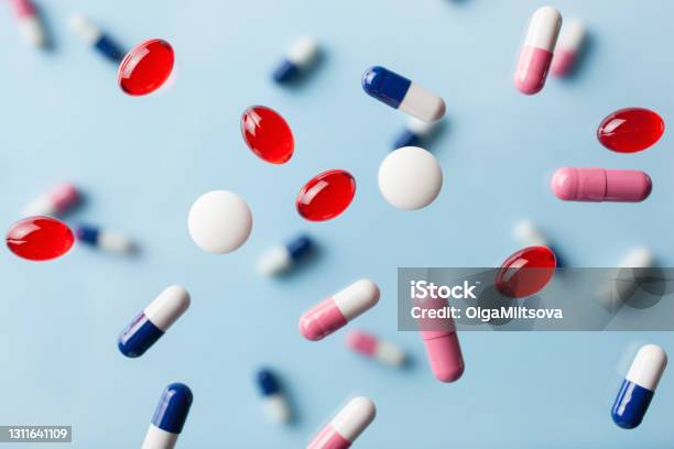 Flying Pill Tablet Capsule Levitation Medicine Medical Treatment For Disease Flu Virus Stock Photo - Download Image Now