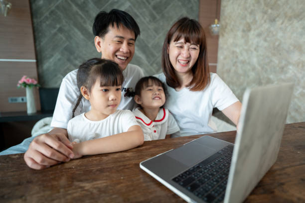istock Social teleconferencing, Asian daughters and single mothers take online classes Via a computer with a wireless internet system. 1311641553