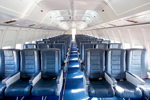 Photo taken inside an empty commercial airplane.