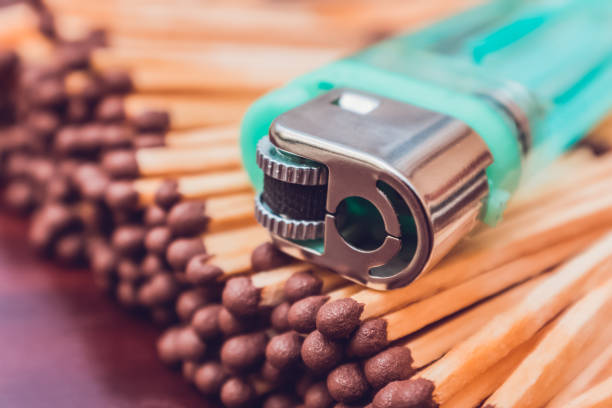 istock A pocket lighter lies on a pile of matches 1311644947