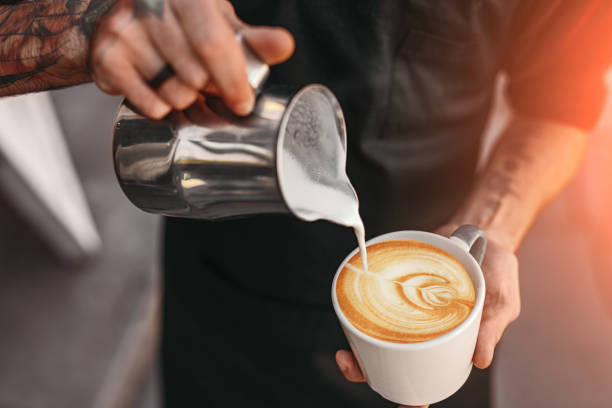 istock Barista making coffee with latte art 1311645773