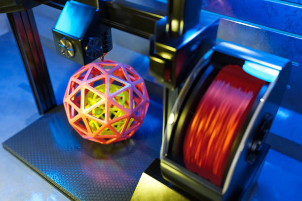 istock 3d rendering of automatic three-dimension 3D printer printing the geometric sphere from hot molten plastic. 1311646112