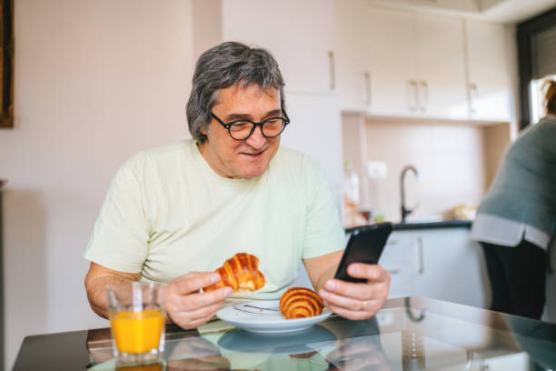 istock Mature man has got a breakfast in his home. 1311647473