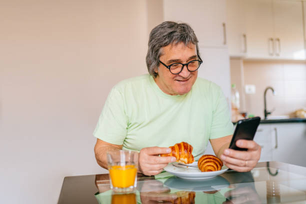 istock Mature man has got a breakfast in his home. 1311647545