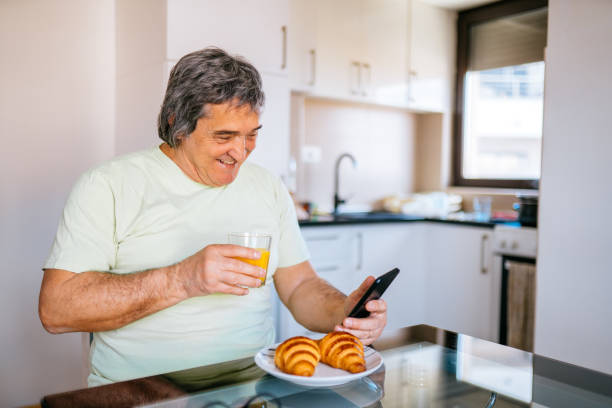 istock Mature man has got a breakfast in his home. 1311647640