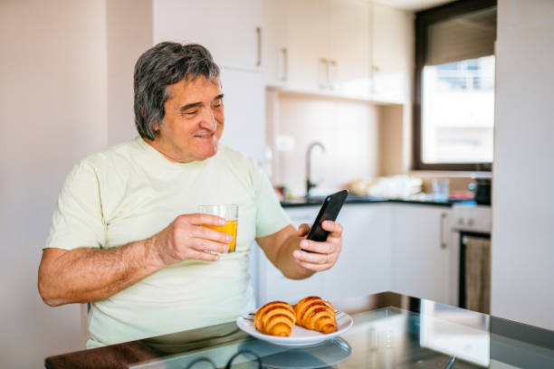 istock Mature man has got a breakfast in his home. 1311647646