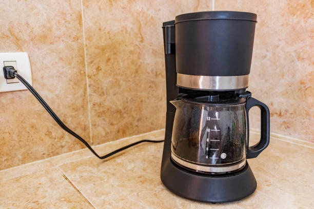 istock Black coffee maker from Mexico on cream background in clean kitchen. 1311647680