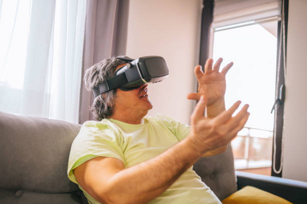 istock Mature man playing at his home - VR 1311648332
