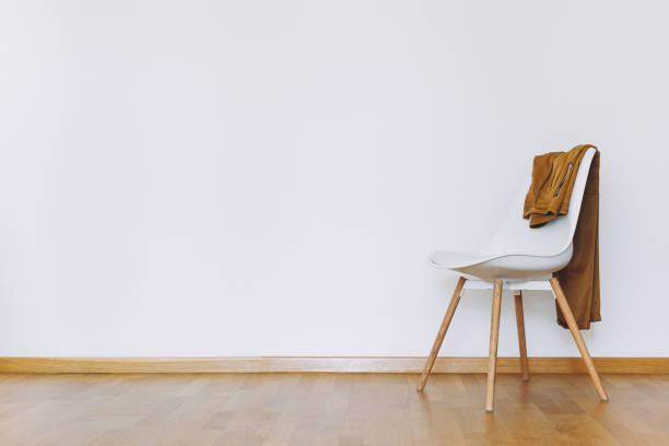 istock Indoors flat wall mockup with Clothes on Chair 1311648841