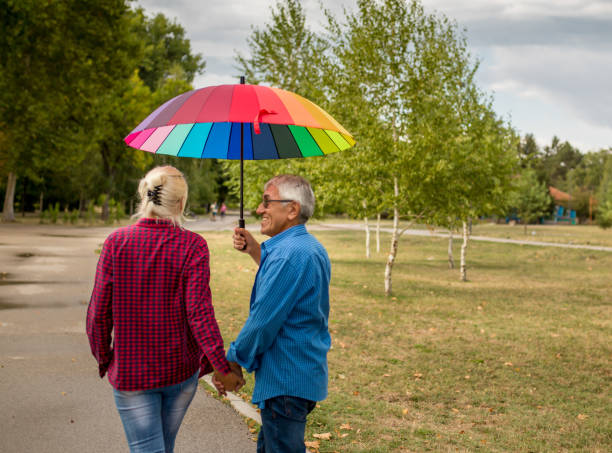 istock Couple walking in wet day 1311650907