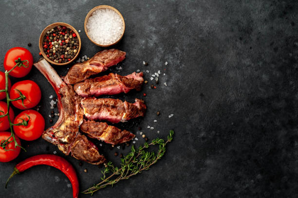 istock grilled beef steak - tomahawk on a stone background. with copy space for your text 1311651316