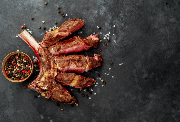 istock grilled beef steak - tomahawk on a stone background. with copy space for your text 1311651651