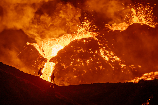 Fagradalsfjall volcano eruptions started in Iceland on 19 of March 2021. Two persons hiking near the volcano to observe the eruption