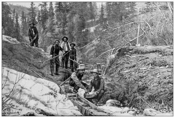 Antique black and white photograph: Klondike gold rush Antique black and white photograph: Klondike gold rush miner photos stock illustrations