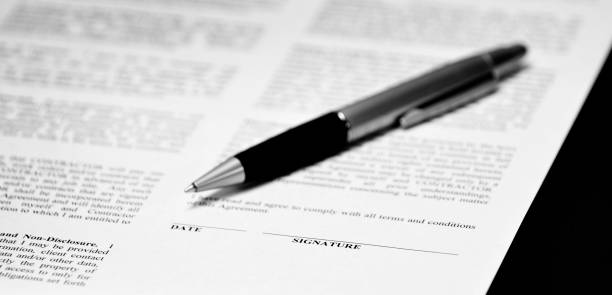 istock Contract with pen on desk signing business transaction 1311652835