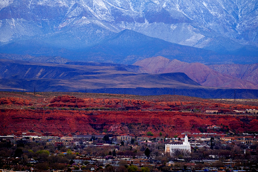 View of St. George Utah valley with red rocks and snow covered mountains