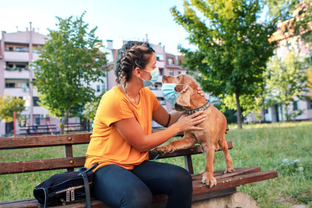 istock Girl walk in park with her dog. 1311654387