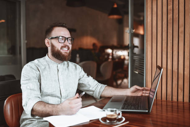 istock Smiling Finishing Up Work For The Day Over Good Coffee 1311657479