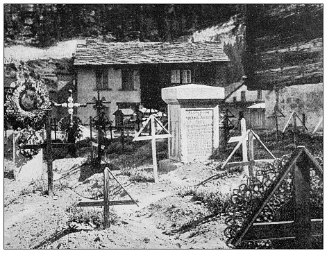 Antique black and white photograph: Zermatt cemetery with tomb of Michel Croz, first victim on the Matterhorn