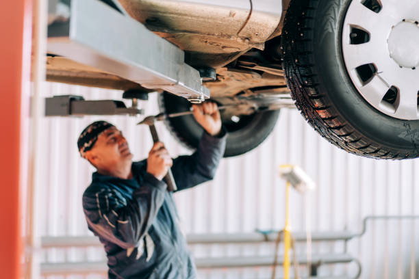 istock Professional mechanic repairs an internal combustion engine and changes the oil. Service station worker 1311664657