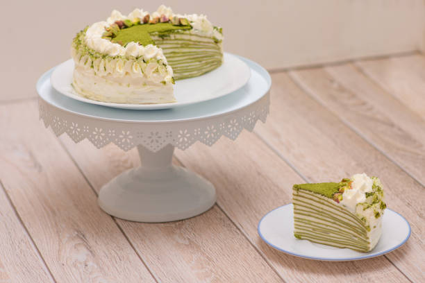 istock Matcha Mille Crepe Cake With A Slice On A Plate 1311664933