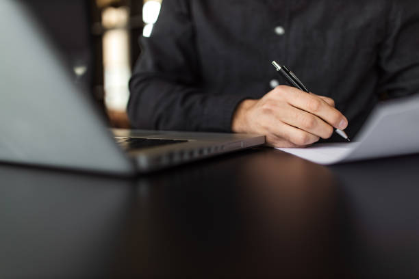 istock Close-up image of a man signing a contract. 1311666112