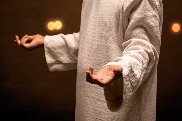 istock Jesus Christ praying and reading the Holy Bible 1311671838