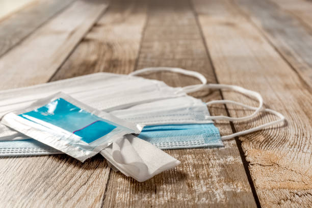 istock Disposable surgical masks, disinfectant wipes and pills 1311673916