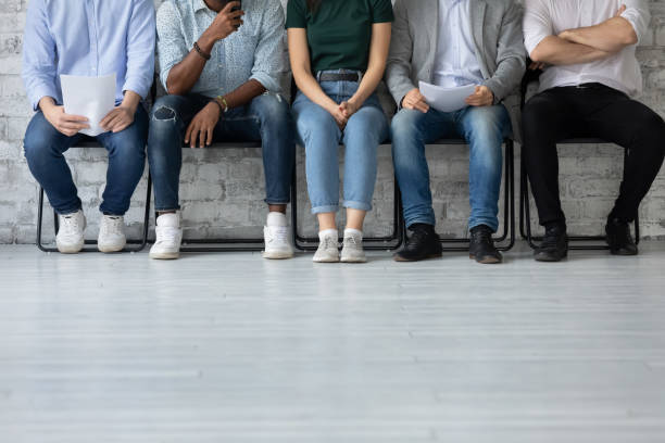 istock Multiethnic job applicants group sitting in row preparing for interview 1311675298