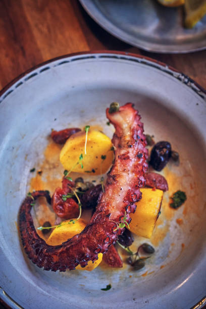 istock Octopus Tentacles with Potatoes and Fresh Lemon 1311679977