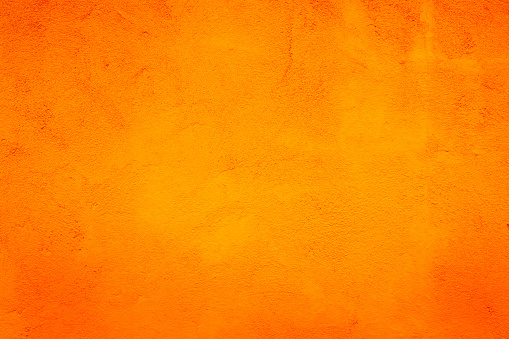 Orange Abstract Background. Painted Orange Color Stucco Wall Texture With Copy Space For Design. Bright Art Wallpaper