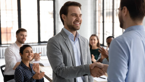 Motivated millennial man intern is being hired on regular job