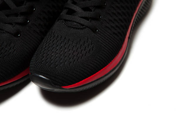 istock Sport black sneakers isolated on white background 1311682356