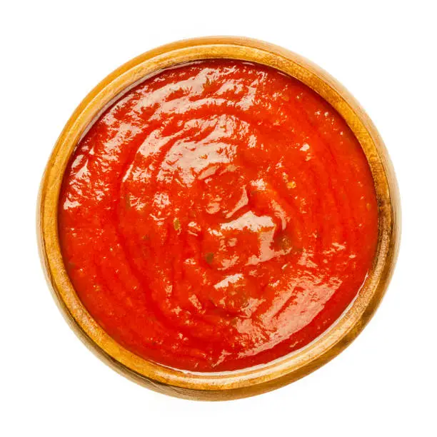 Photo of Tomato sauce with herbs, Neapolitan sauce, salsa roja, in wooden bowl